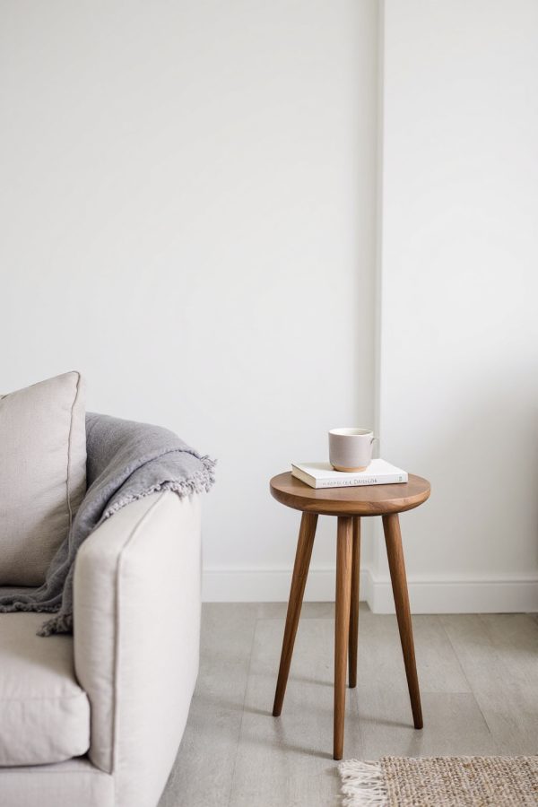 Walnut side table beside the sofa
